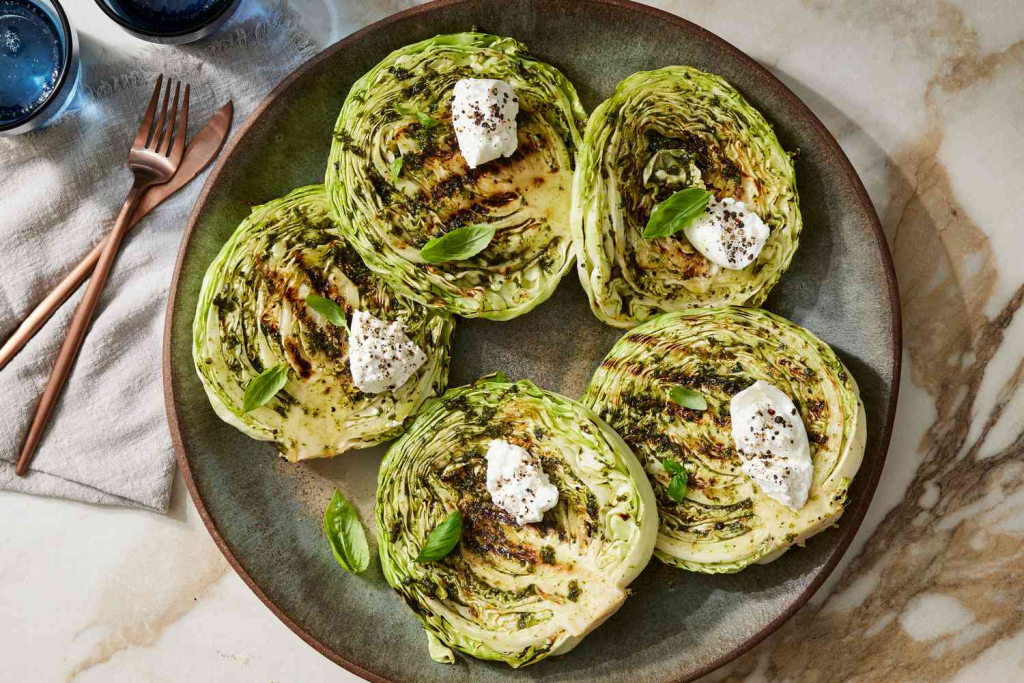 How to cook cabbage steaks like a pro. Discover the viral US winter hit with this easy roasted recipe featuring garlic, parmesan, and crispy golden edges.