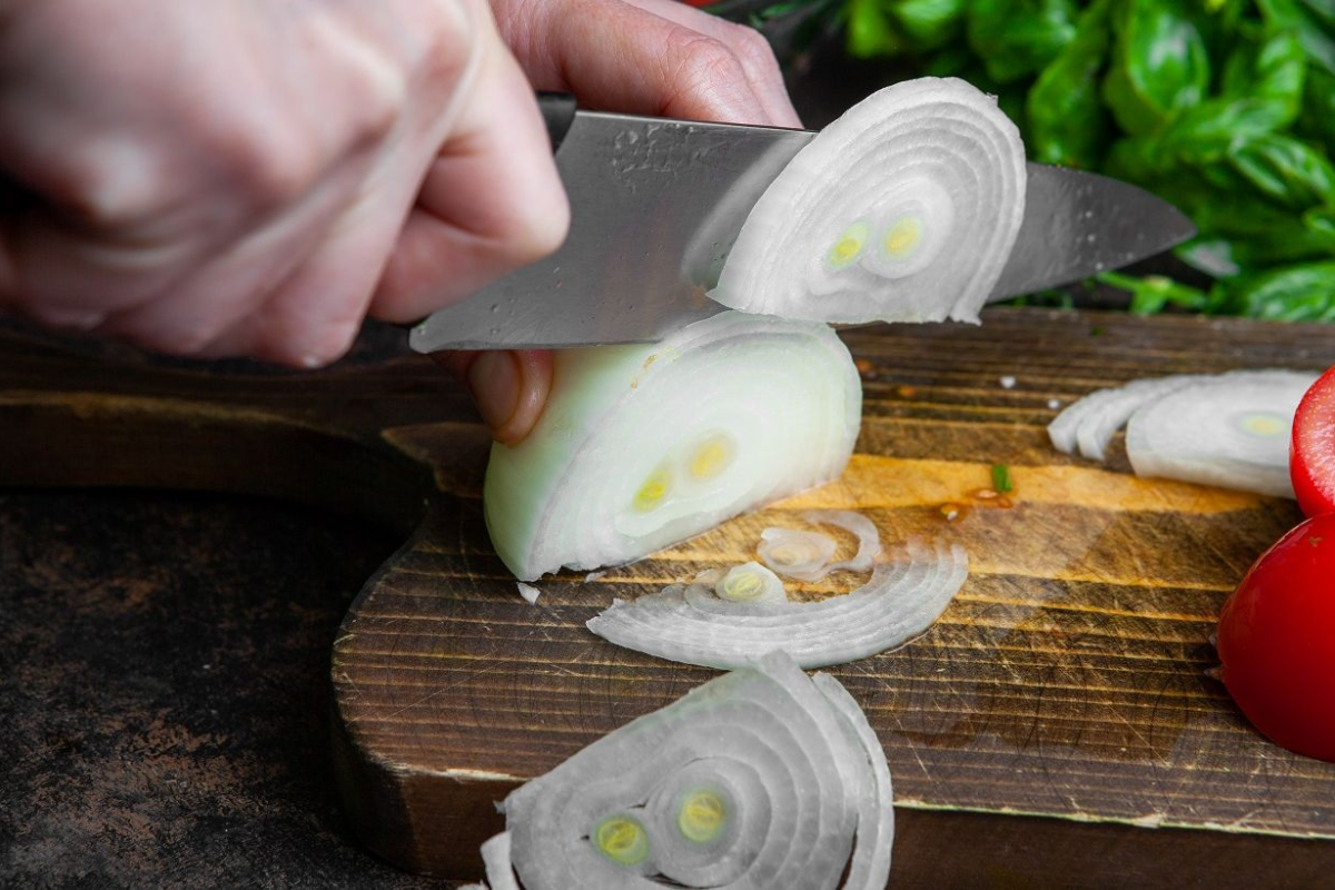 How to cut onions without crying using proven chef techniques and scientific hacks. Learn about chilling, knife sharpening, and ventilation for a better kitchen.