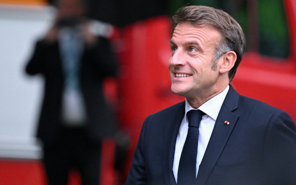 French President Macron defends EU AI rules, pledges child protection, as global leaders warn about AI safety and monopolies during Delhi summit.