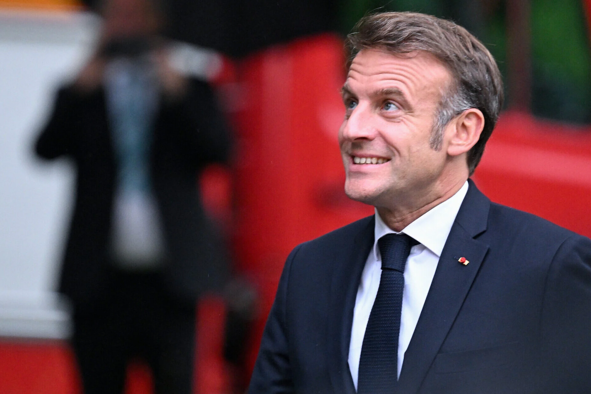French President Macron defends EU AI rules, pledges child protection, as global leaders warn about AI safety and monopolies during Delhi summit.