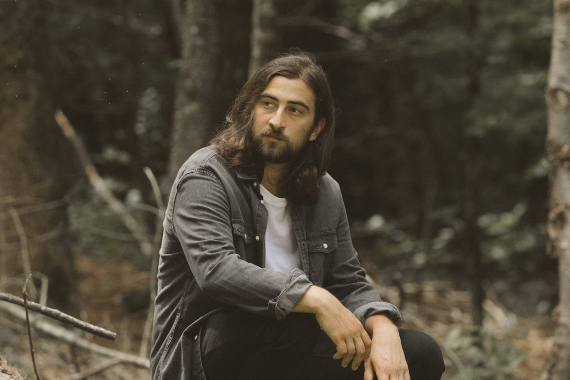 Noah Kahan premieres “The Great Divide” video during the Grammys and announces his 2026 North American tour, sharing childhood flashbacks and Easter eggs.