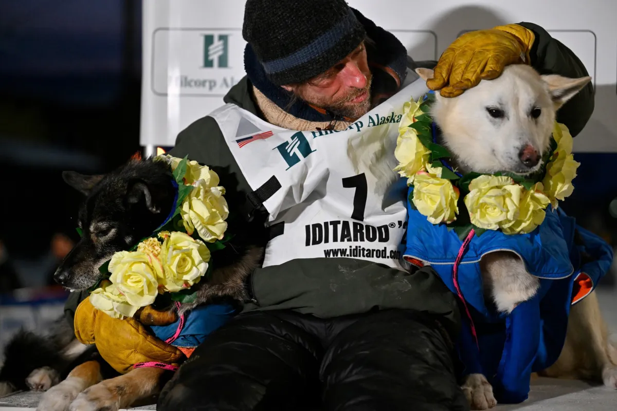 Jessie Holmes wins Iditarod 2026, completing 1,000-mile Alaska race in nine days with lead dogs Zeus and Polar amid record prize boost and criticism.