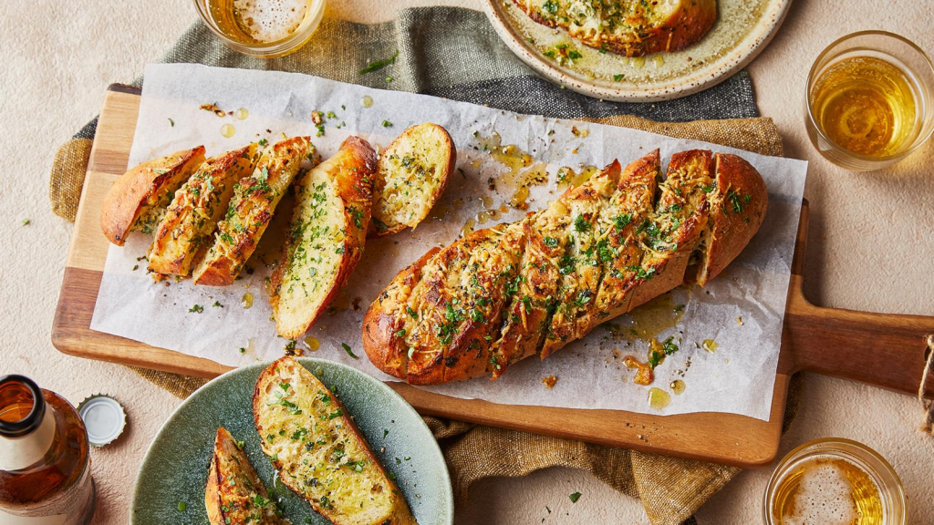 Make crispy, buttery garlic bread at home in 15 minutes. Simple recipe with garlic butter, herbs, and optional cheese. Perfect with pasta or soup.