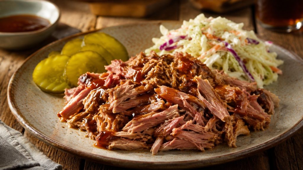 Carolina pulled pork with vinegar sauce: learn how to season, slow-cook, shred, and serve tender pork using an oven or smoker.