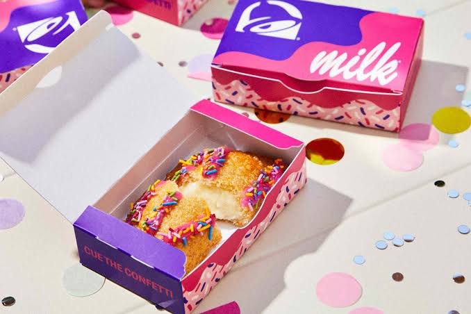 Taco Bell Birthday Cake Empanada launches October 15 with Milk Bar cake batter filling, pink frosting and rainbow sprinkles for a limited time.
